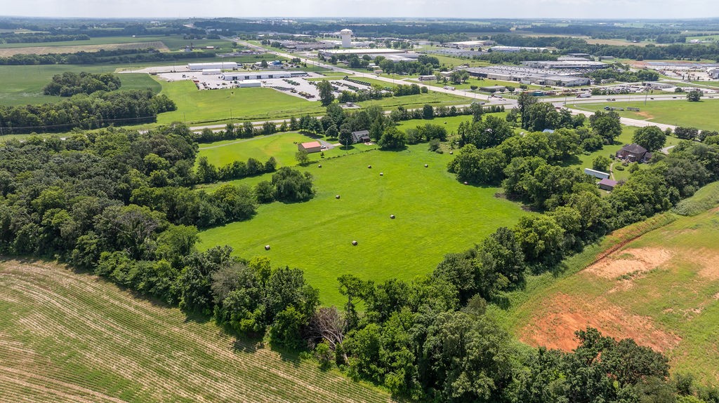 2450 Pembroke Road Hopkinsville, KY 42240 - Photo 10 of 12 an aerial view of ocean with residential houses with outdoor space and swimming pool