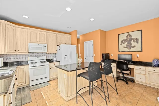 a kitchen with a sink cabinets and stainless steel appliances