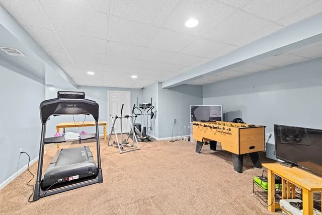 a room with furniture and a flat screen tv