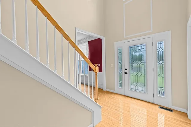 a view of an entryway with wooden floor