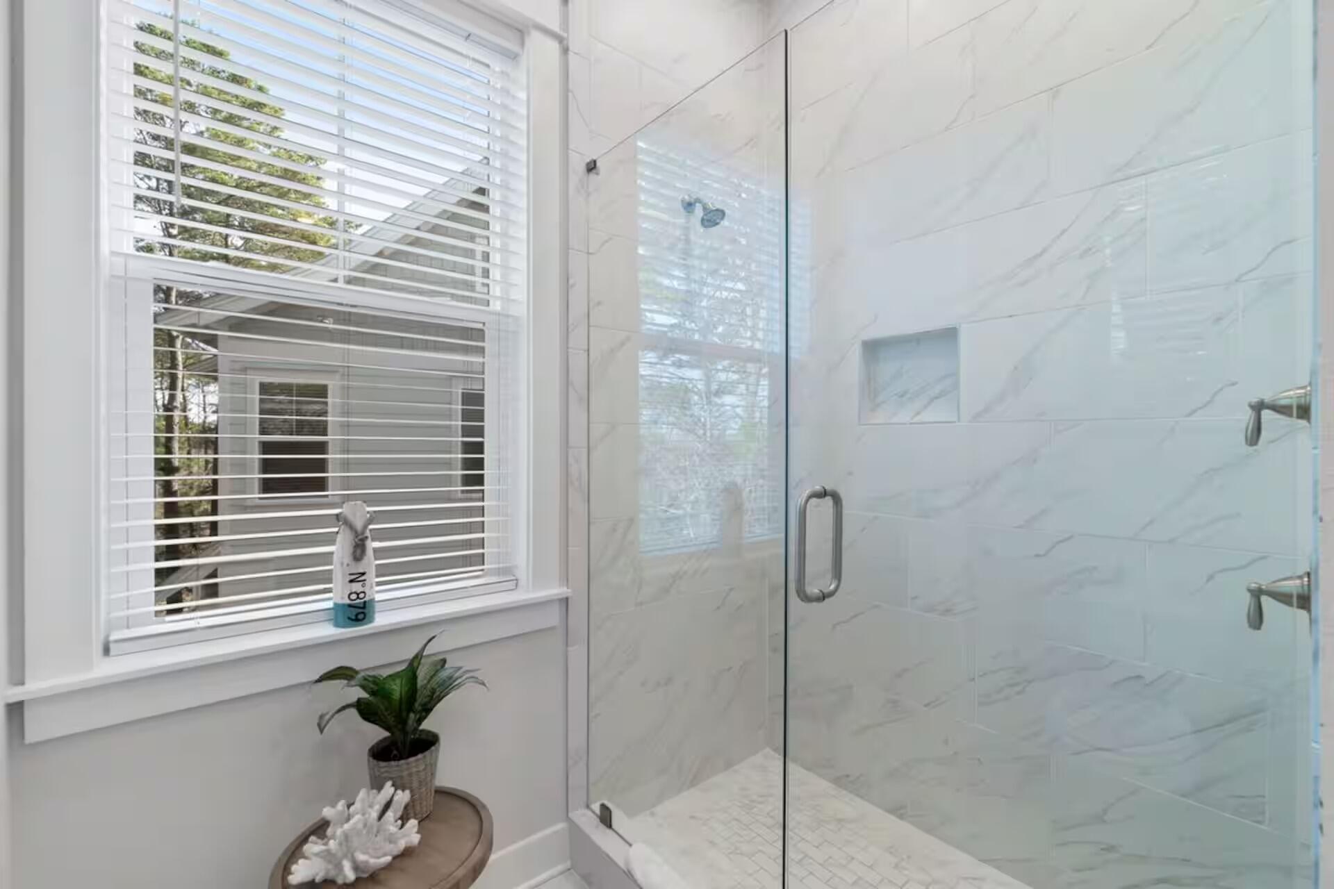 146 East E Pine, Unit B Inlet Beach, FL 32461 - Photo 28 of 47 a bathroom with a shower and a window