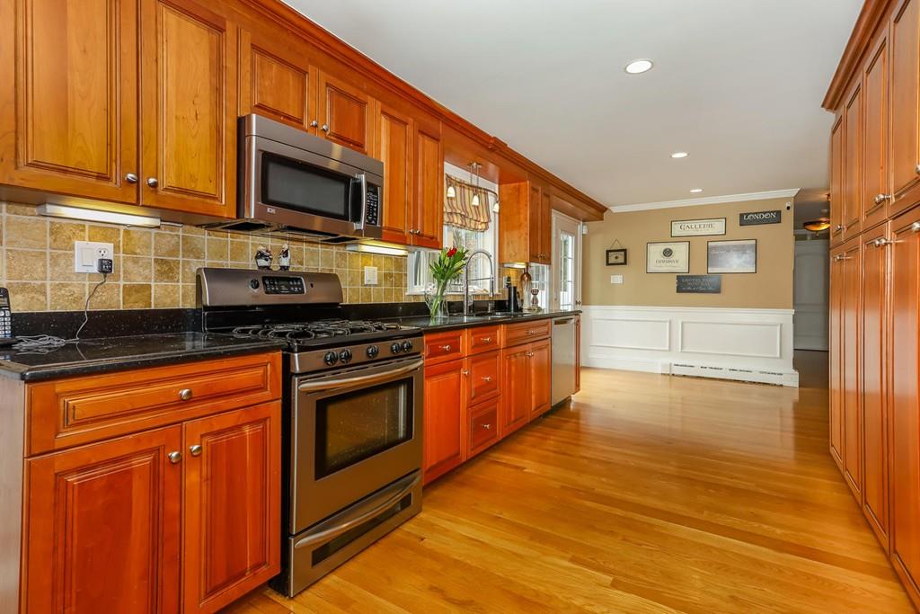 17 Fairview Road Canton, MA 02021 - Photo 11 of 40 a kitchen with stainless steel appliances granite countertop a stove a sink and a microwave