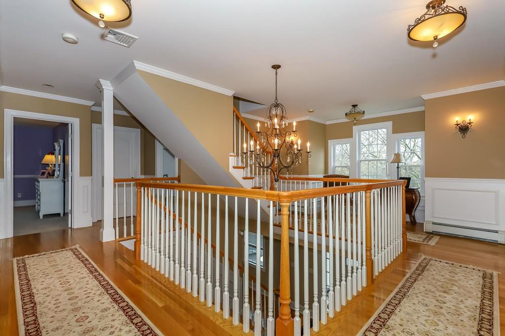 17 Fairview Road Canton, MA 02021 - Photo 18 of 40 a view of a hallway with a chandelier