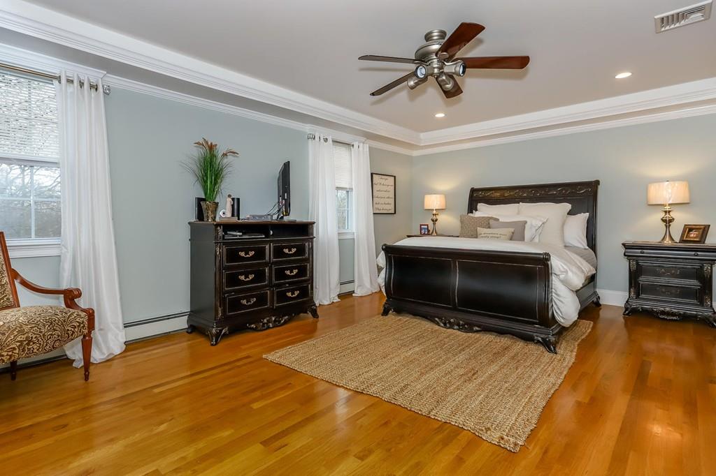 17 Fairview Road Canton, MA 02021 - Photo 19 of 40 a bedroom with a bed and a chandelier