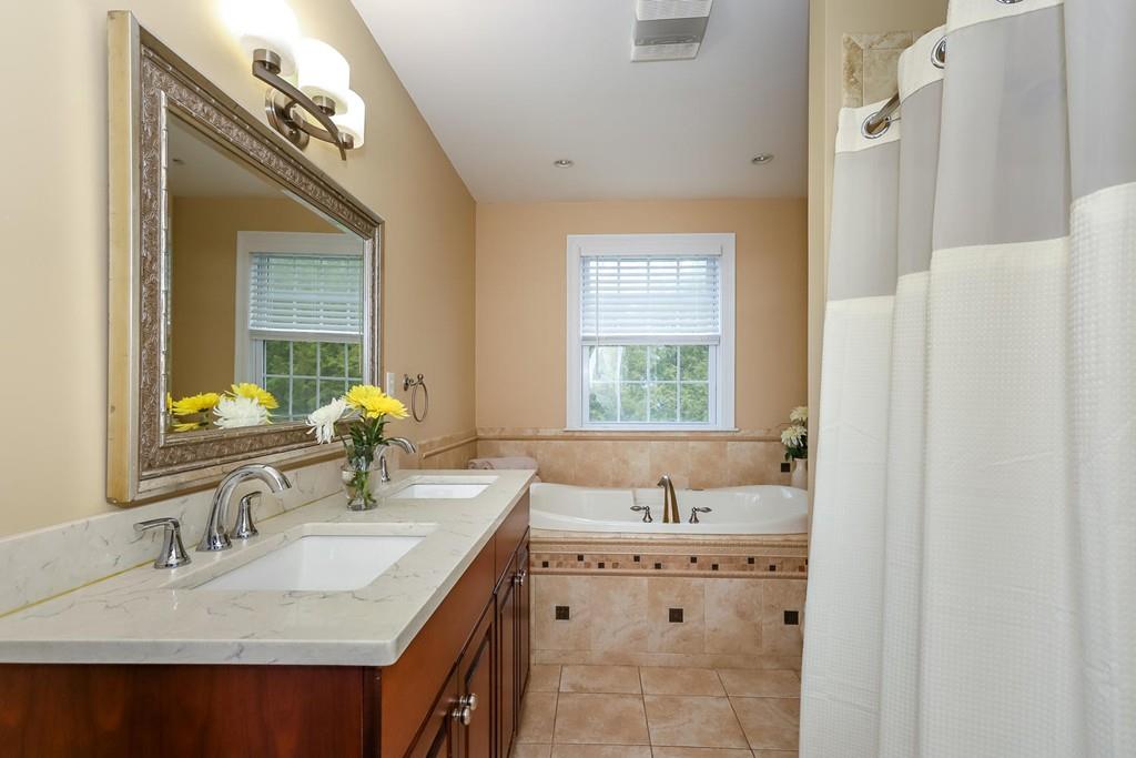 17 Fairview Road Canton, MA 02021 - Photo 21 of 40 a bathroom with a sink double vanity and a mirror