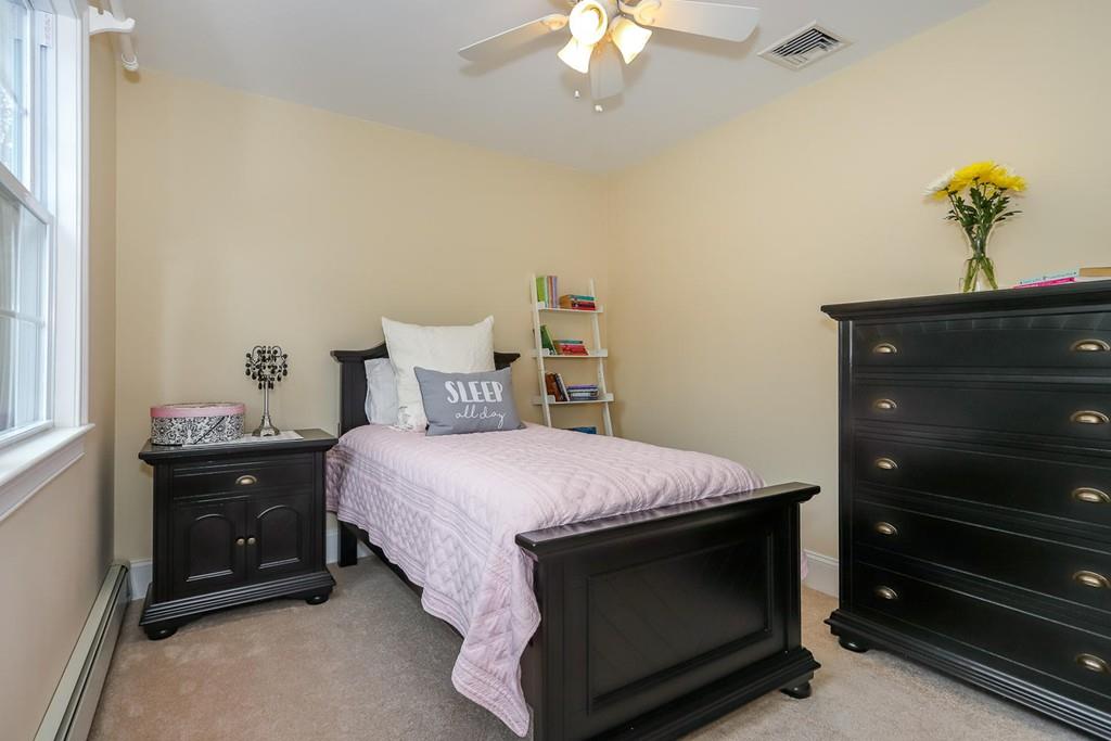 17 Fairview Road Canton, MA 02021 - Photo 24 of 40 a bed room with a bed and a chandelier