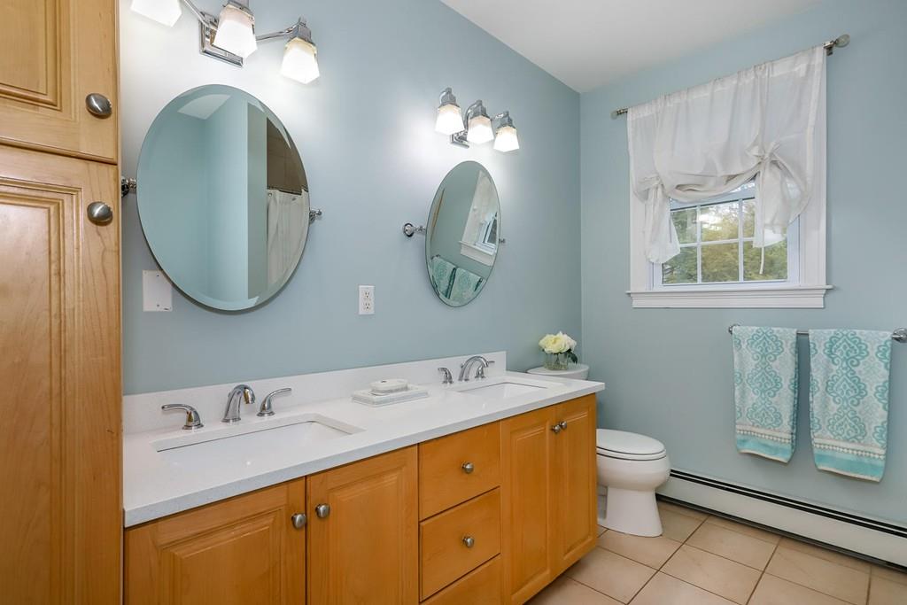 17 Fairview Road Canton, MA 02021 - Photo 25 of 40 a bathroom with a toilet sink and mirror