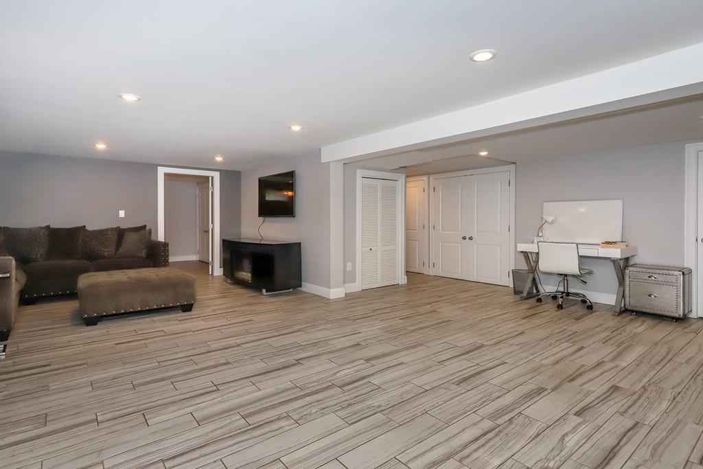 17 Fairview Road Canton, MA 02021 - Photo 27 of 40 a living room with furniture and a fireplace