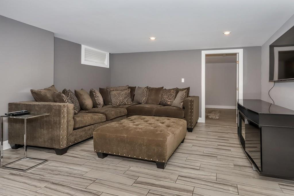 17 Fairview Road Canton, MA 02021 - Photo 29 of 40 a living room with furniture and a wooden floor