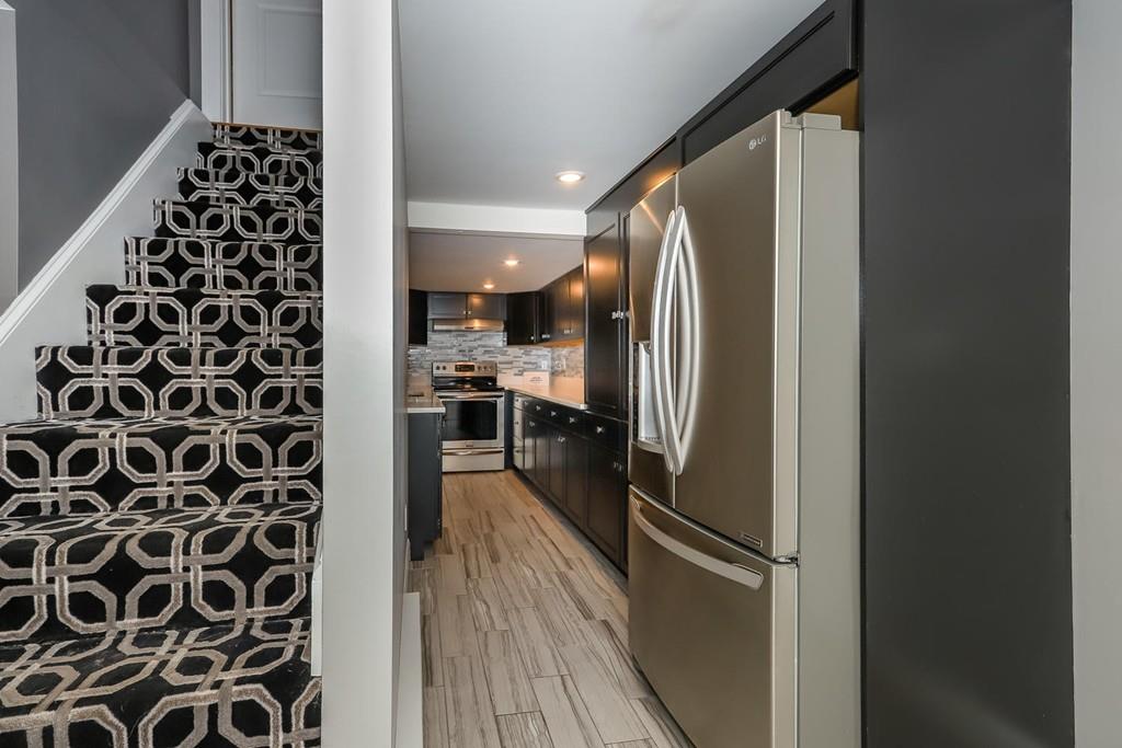 17 Fairview Road Canton, MA 02021 - Photo 30 of 40 a kitchen with a refrigerator and a stove top oven