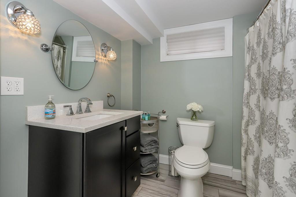 17 Fairview Road Canton, MA 02021 - Photo 33 of 40 a bathroom with a toilet sink and mirror