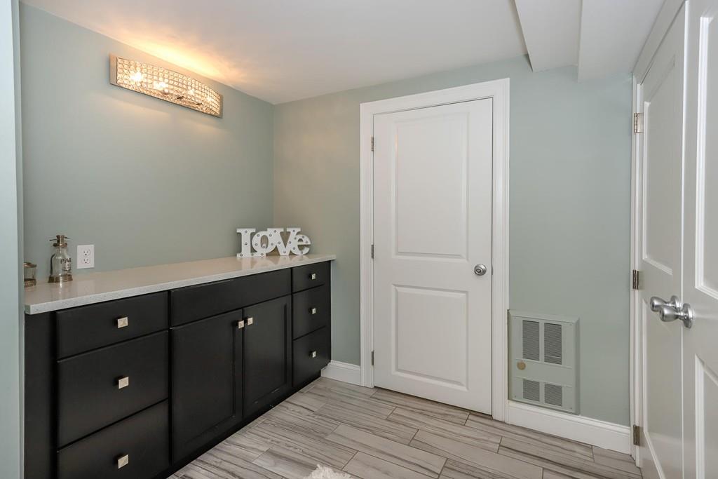 17 Fairview Road Canton, MA 02021 - Photo 34 of 40 a spacious bathroom with a double vanity sink a large mirror and a shower