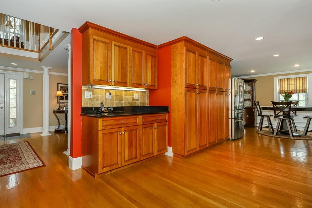 17 Fairview Road Canton, MA 02021 - Photo 10 of 40 a view of a livingroom with kitchen furniture and wooden floor