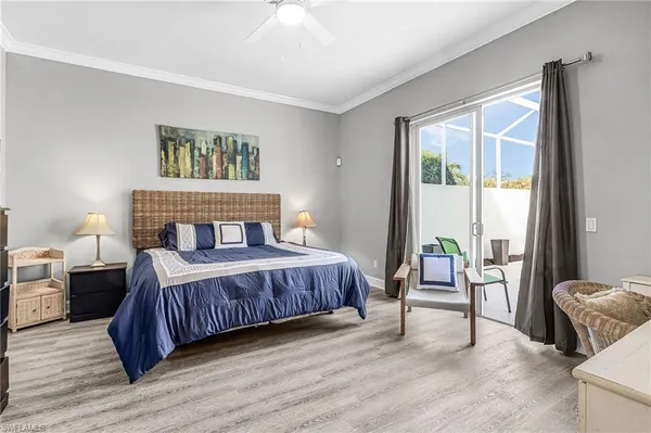 a bedroom with a large bed and a large window