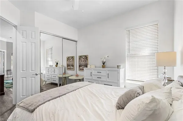 a bedroom with a bed and a closet