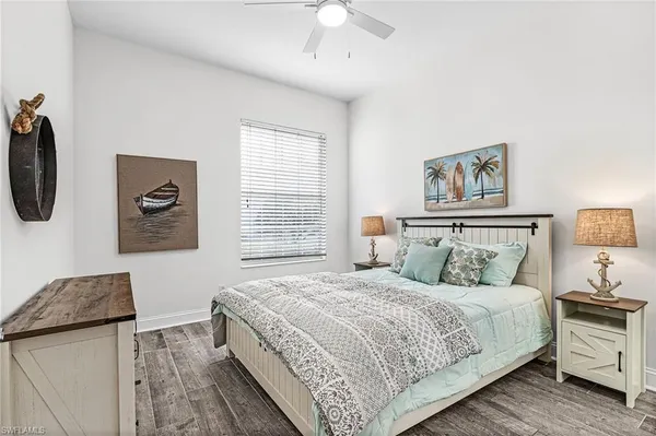 a bedroom with bed and window