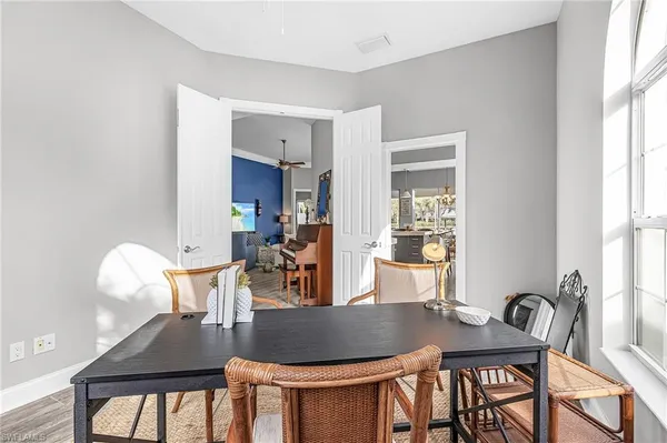 a dining room with furniture and window