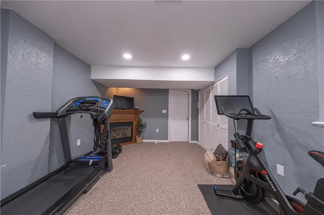 a white toilet sitting next to a bathroom sink