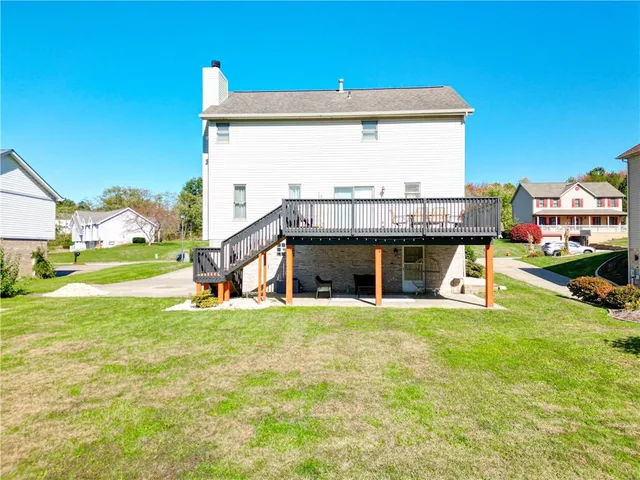 an aerial view of a house with a lake view