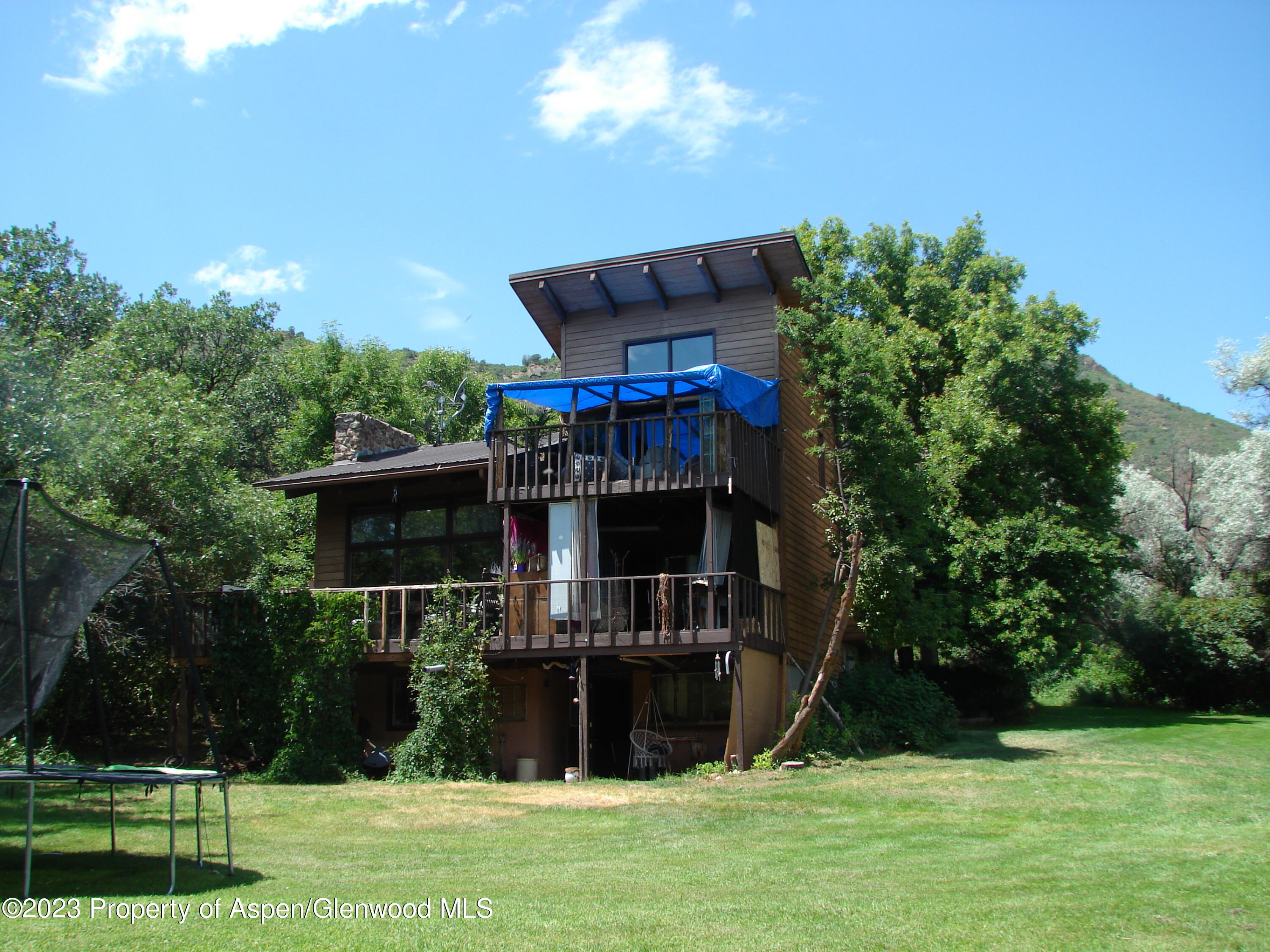 60 Chelyn Road Glenwood Springs, CO 81601 - Photo 21 of 53 a front view of a house with a yard