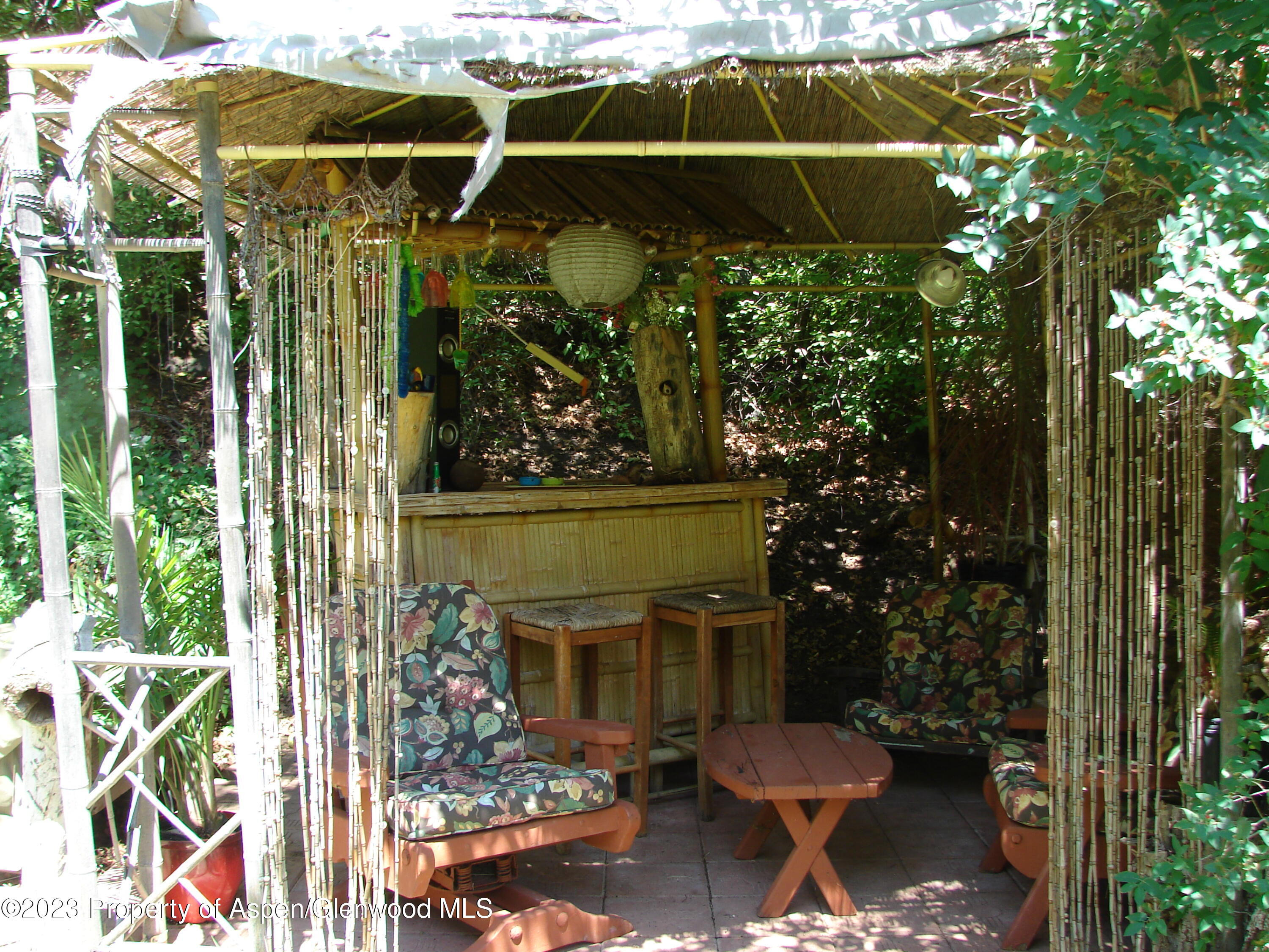 60 Chelyn Road Glenwood Springs, CO 81601 - Photo 27 of 53 a view of a chairs and table in a backyard
