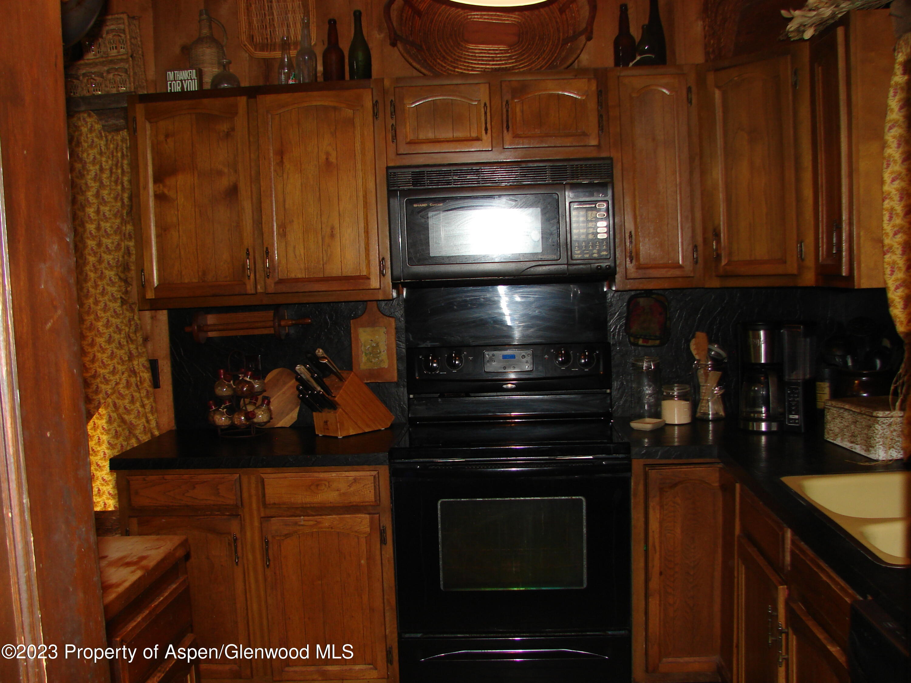 60 Chelyn Road Glenwood Springs, CO 81601 - Photo 32 of 53 a kitchen with granite countertop stainless steel appliances and cabinets
