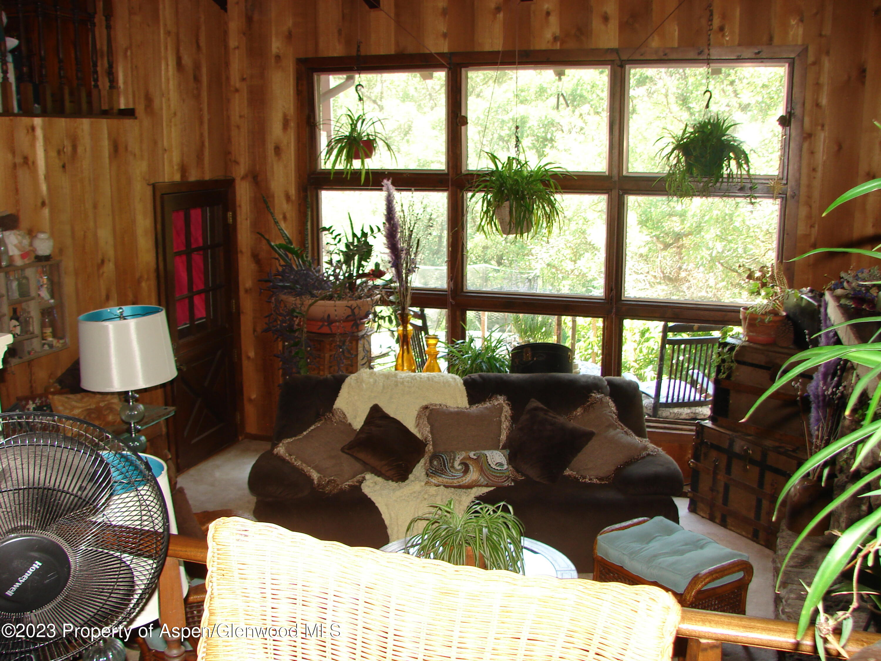 60 Chelyn Road Glenwood Springs, CO 81601 - Photo 35 of 53 a living room with furniture and a window