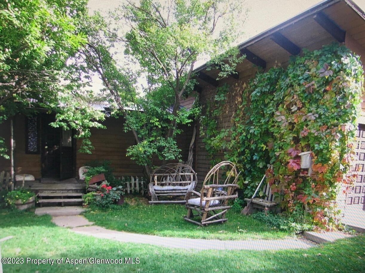 60 Chelyn Road Glenwood Springs, CO 81601 - Photo 4 of 53 a front view of a house with garden and trees