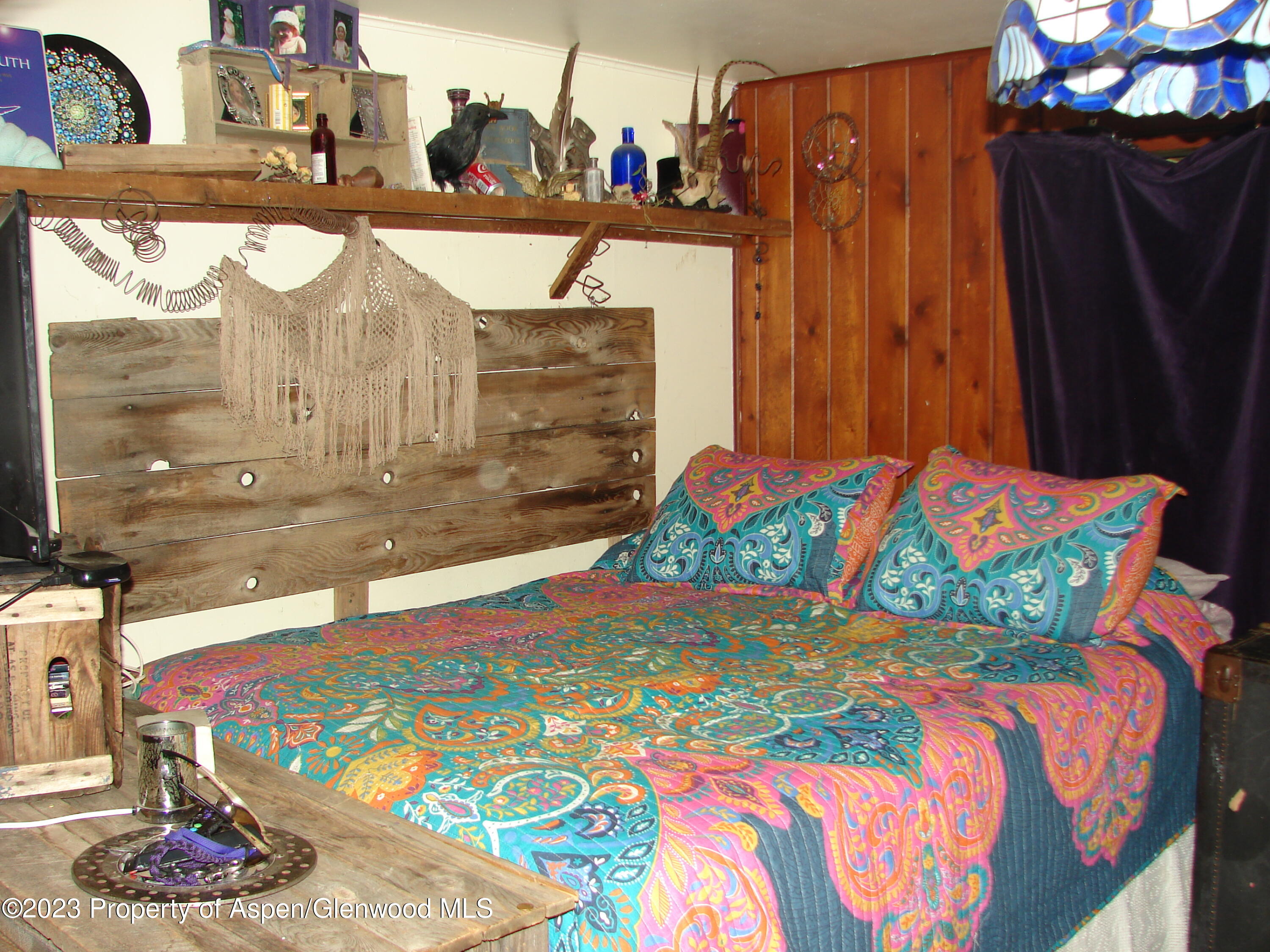 60 Chelyn Road Glenwood Springs, CO 81601 - Photo 43 of 53 a bedroom with a bed and dresser