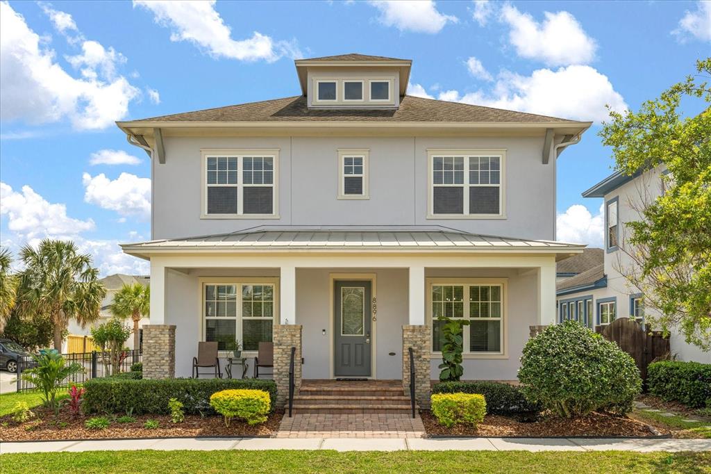 8896 Reymont Street Orlando, FL 32827 - Photo 1 of 1 front view of a house with a yard