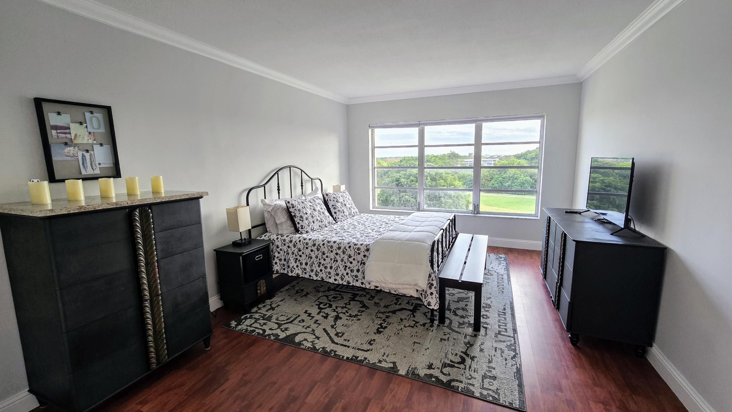 3100 North Palm Aire Drive, Unit 604 Pompano Beach, FL 33069 - Photo 12 of 25 a living room with furniture and a flat screen tv
