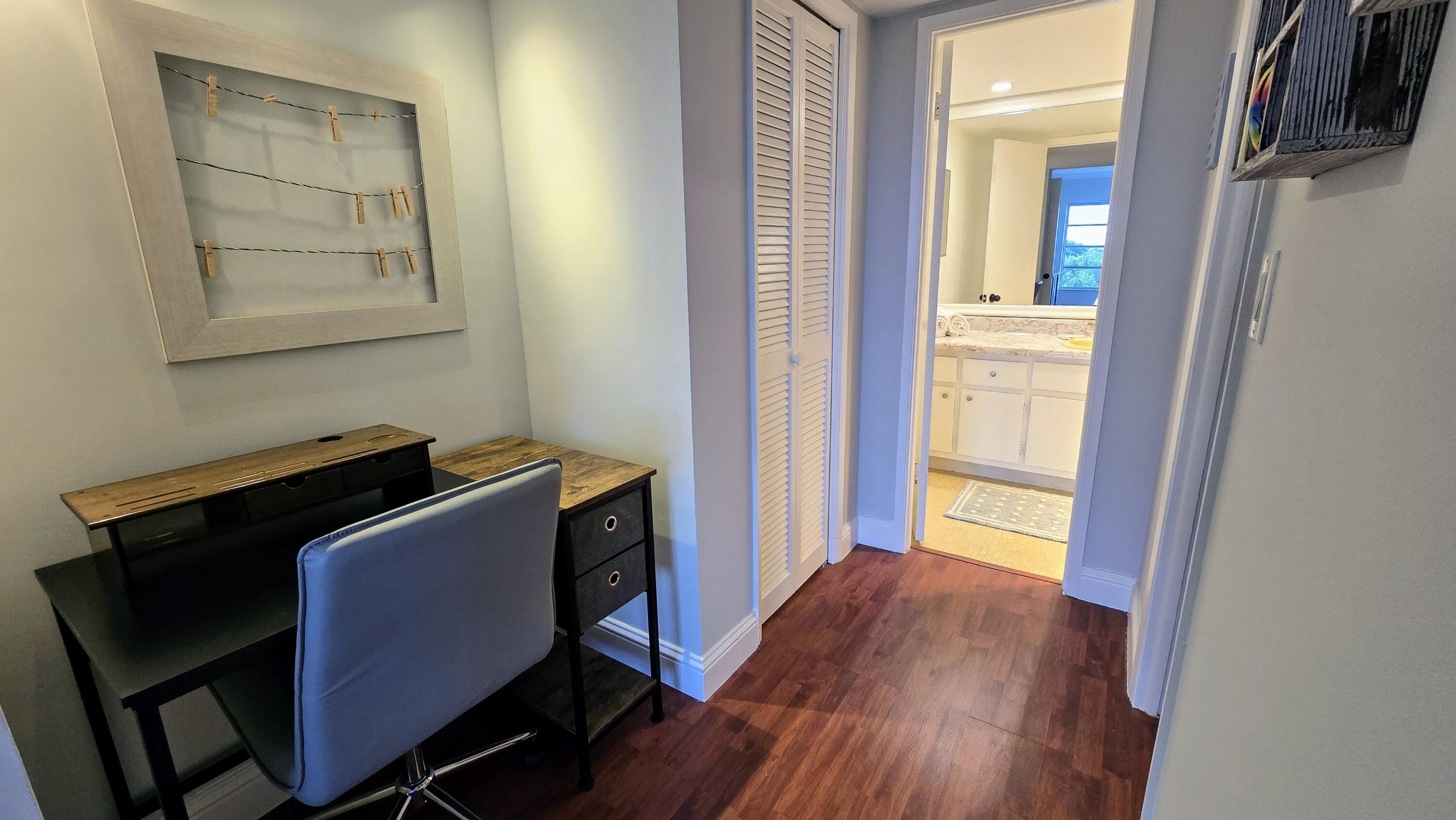 3100 North Palm Aire Drive, Unit 604 Pompano Beach, FL 33069 - Photo 15 of 25 a room with wooden floor and windows