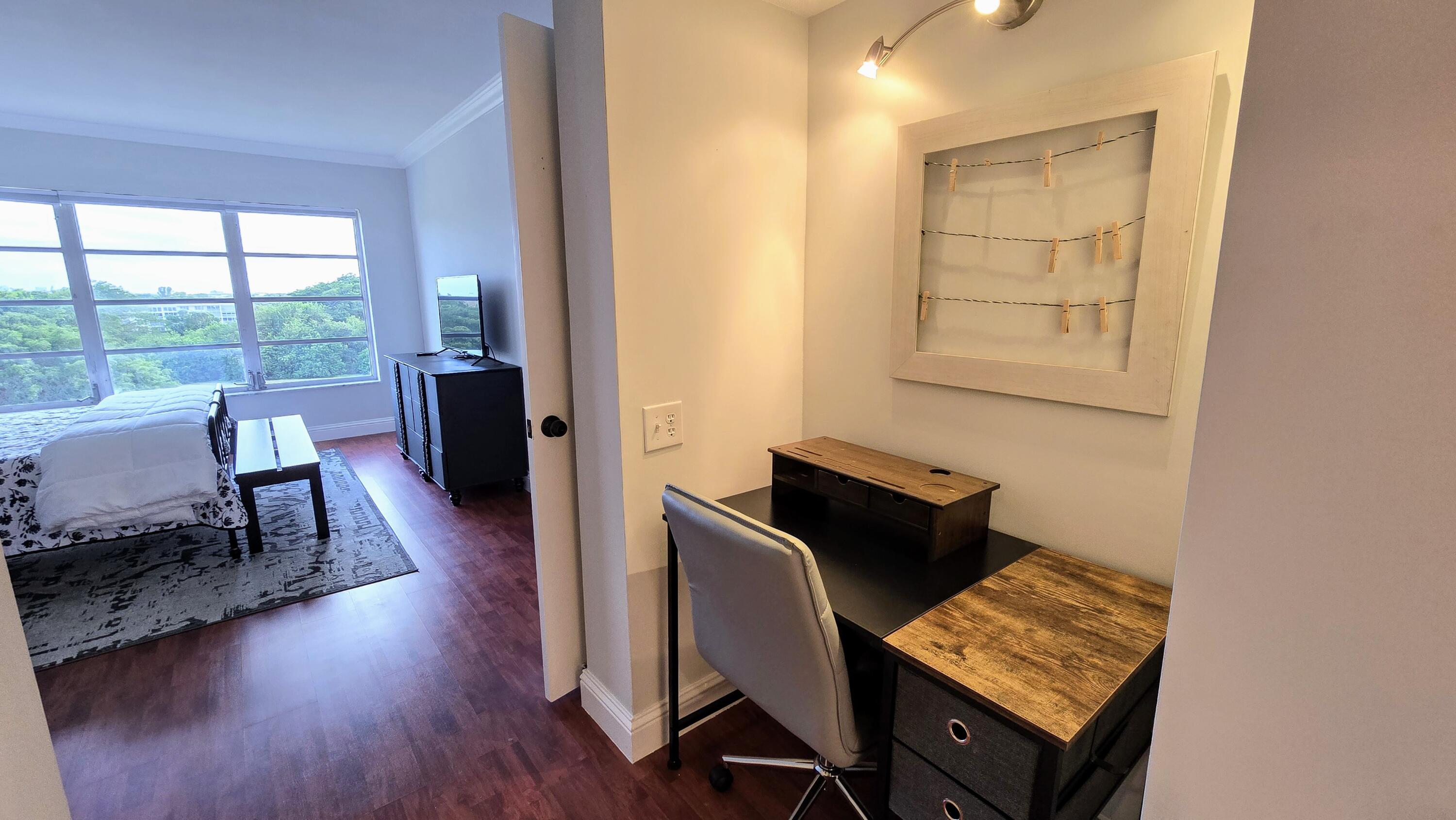 3100 North Palm Aire Drive, Unit 604 Pompano Beach, FL 33069 - Photo 16 of 25 a living room with furniture and wooden floor