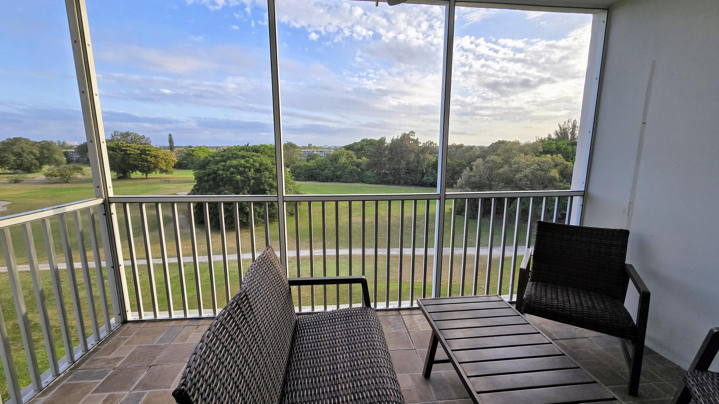 3100 North Palm Aire Drive, Unit 604 Pompano Beach, FL 33069 - Photo 20 of 25 a view of a balcony with wooden floor