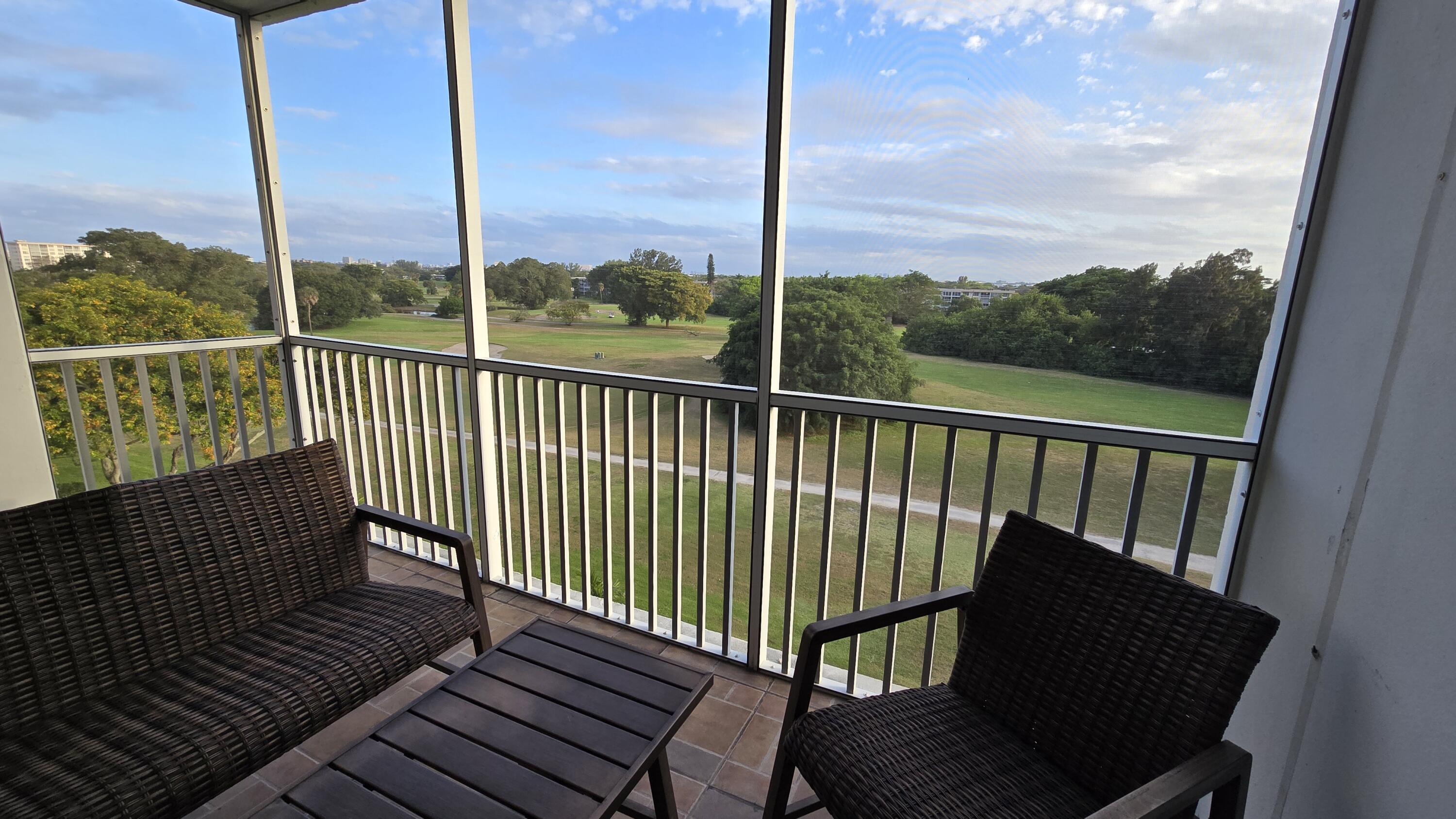 3100 North Palm Aire Drive, Unit 604 Pompano Beach, FL 33069 - Photo 21 of 25 a view of a chair in the balcony