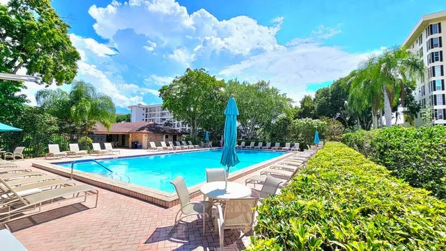 a view of a swimming pool with a patio