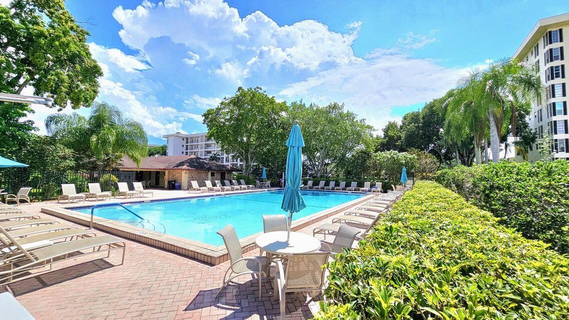 3100 North Palm Aire Drive, Unit 604 Pompano Beach, FL 33069 - Photo 4 of 25 a view of a swimming pool with a patio