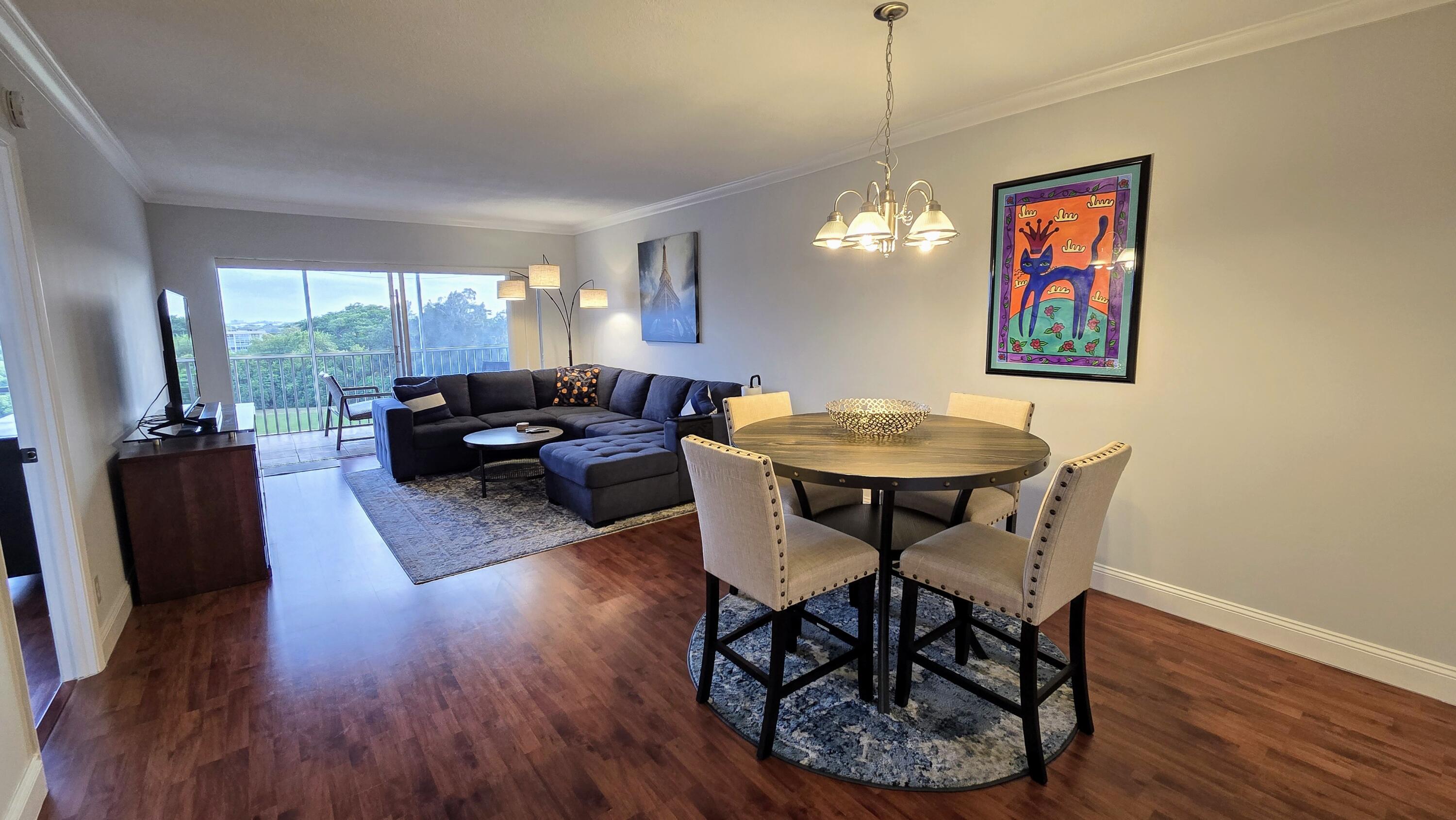 3100 North Palm Aire Drive, Unit 604 Pompano Beach, FL 33069 - Photo 5 of 25 a living room with furniture a window and a dining table