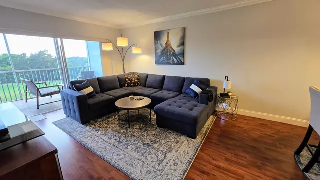 a living room with furniture and a rug
