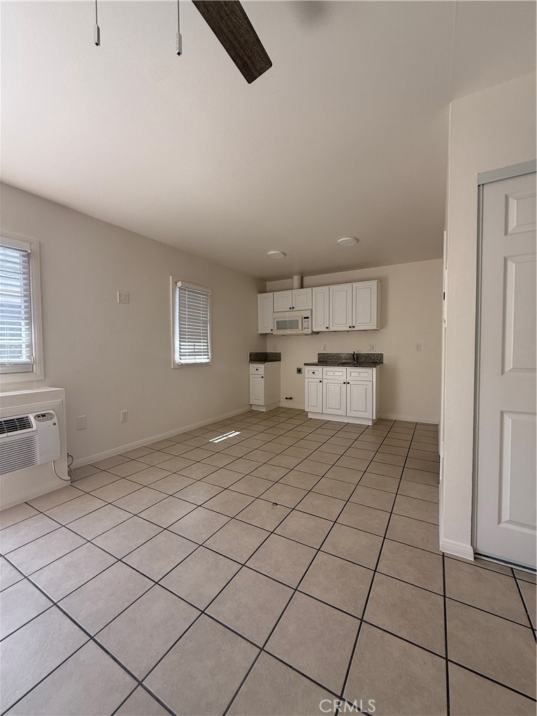 1127 Magnolia Avenue, Unit 10 Long Beach, CA 90813 - Photo 1 of 1 a view of kitchen and empty room with windows