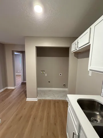 a kitchen with a sink and cabinets