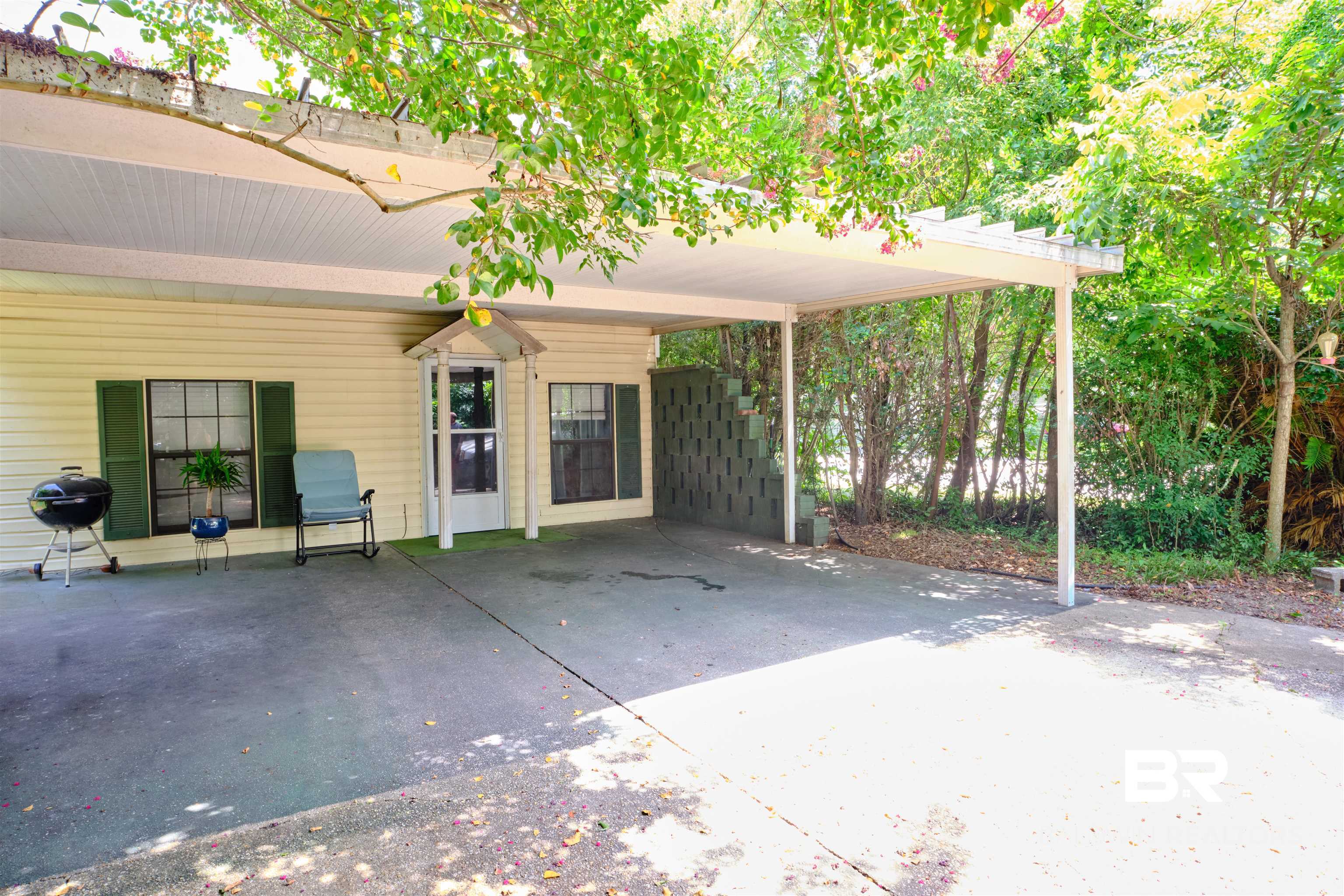 101 West Horner Street Atmore, AL 36502 - Photo 32 of 38 View of patio / terrace with a carport