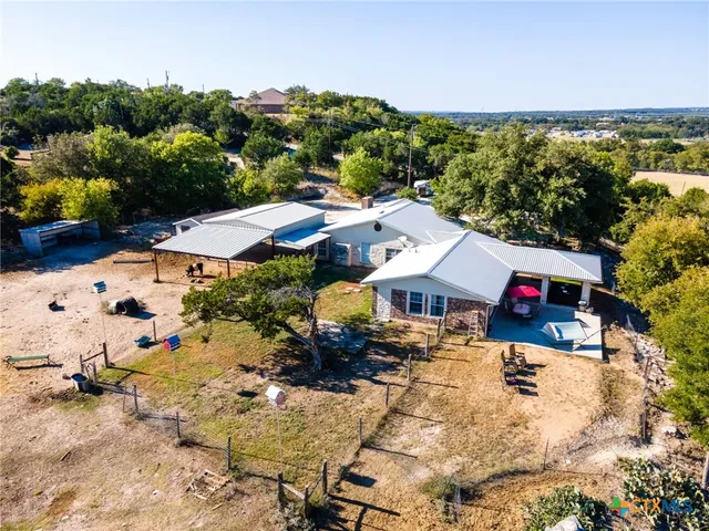 an aerial view of houses with yard