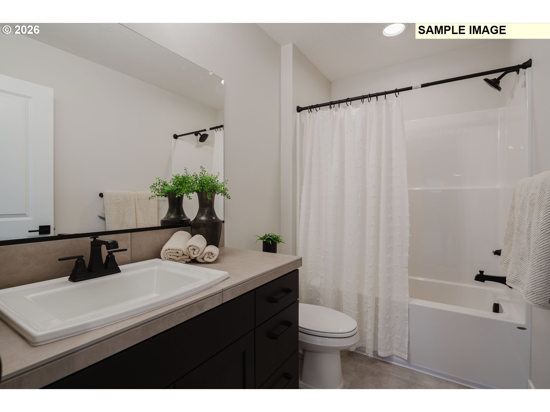 1403 North 41st Place Ridgefield, WA 98642 - Photo 28 of 30 a bathroom with a sink a toilet and shower