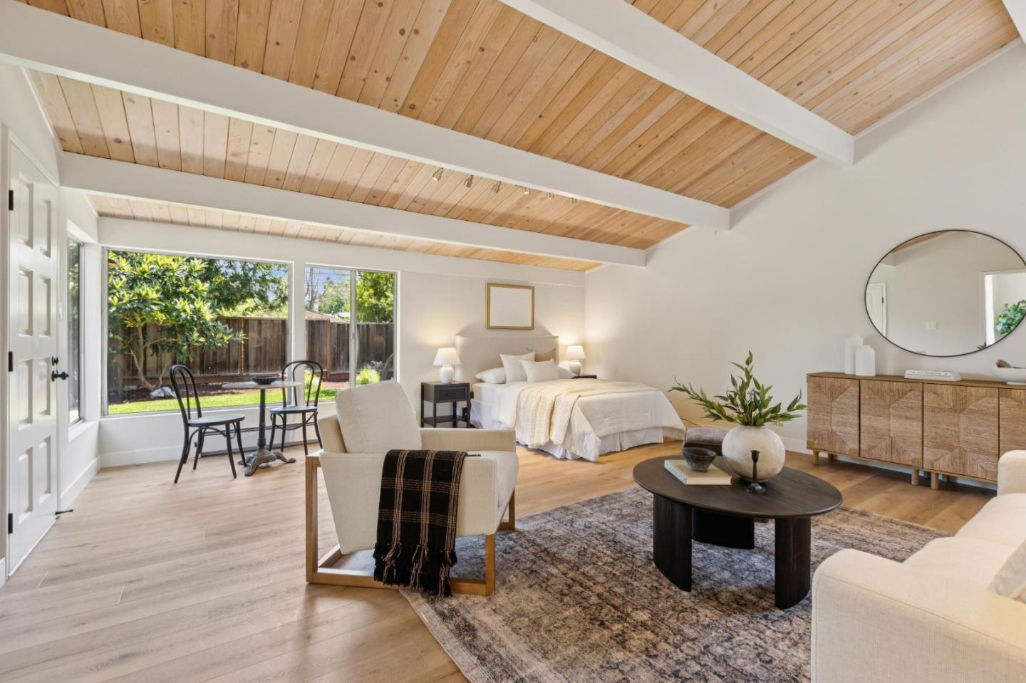 755 Santa Rita Avenue Los Altos, CA 94022 - Photo 22 of 50 a living room with furniture a large window and wooden floor