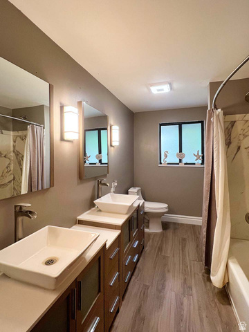 3138 Jean Street Magna, UT 84044 - Photo 11 of 26 Bathroom featuring dual vessel sinks set on wood-finish vanities with light countertops