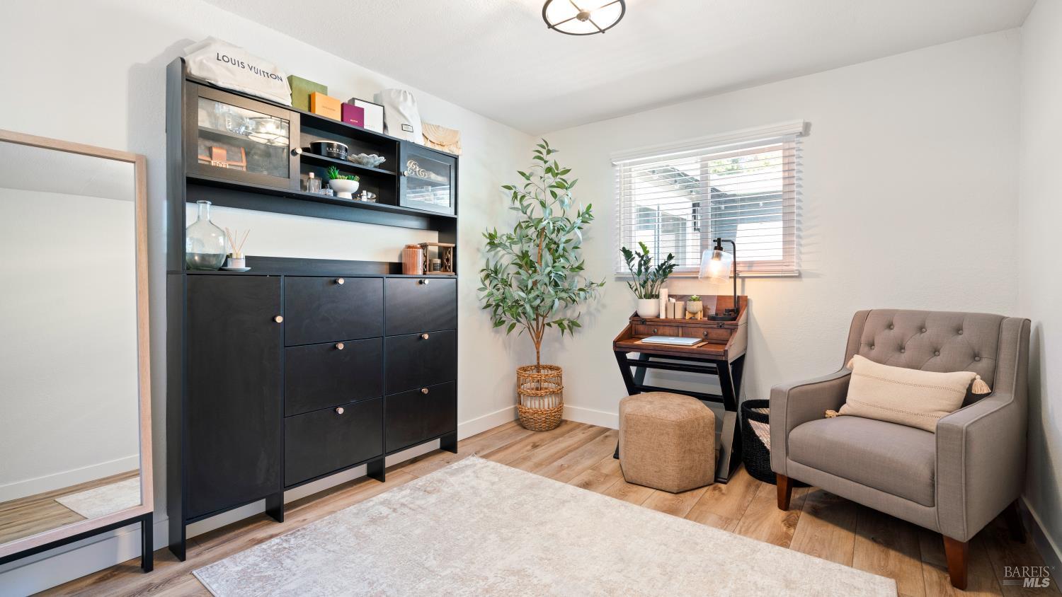 1550 Laguna Road Santa Rosa, CA 95401 - Photo 32 of 35 Third bedroom or make it your office with vinyl flooring and new paint. Notice newer textured ceilings entire hosue