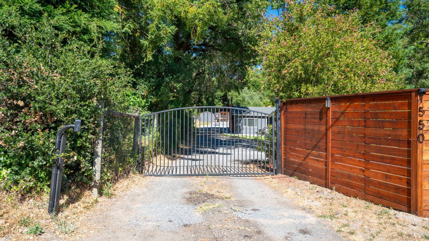 1550 Laguna Road Santa Rosa, CA 95401 - Photo 4 of 35 New gate with code and new wood decorative fencing