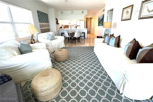 a view of a dining room with furniture and a livingroom