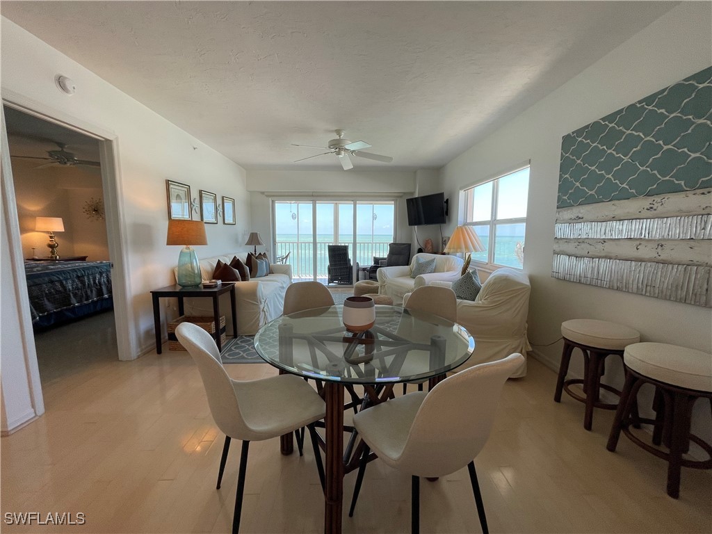 1020 South Collier Boulevard, Unit 507 Marco Island, FL 34145 - Photo 13 of 25 a view of a dining room with furniture and a livingroom